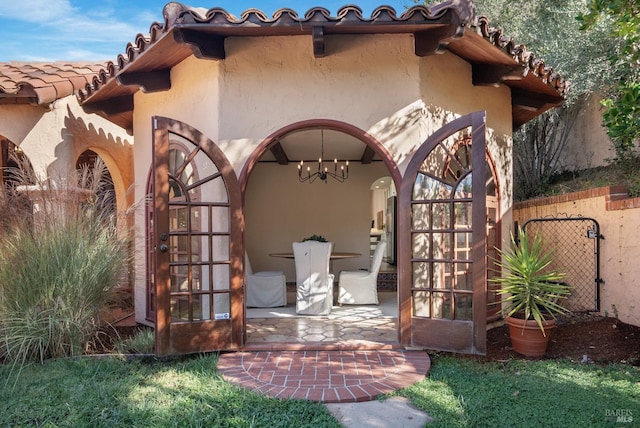 107 Deer Hollow Rd, San Anselmo, CA 94960 - entrance to property featuring stucco siding, a tiled roof, and a patio area