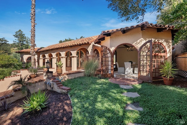 107 Deer Hollow Rd, San Anselmo, CA 94960 - view of front facade with stucco siding, a tile roof, and a front lawn