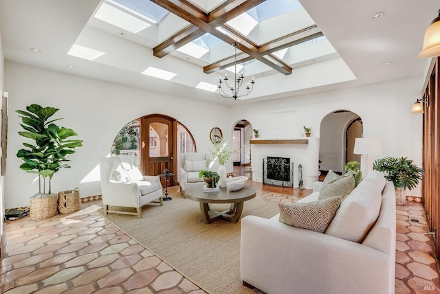 107 Deer Hollow Rd, San Anselmo, CA 94960 - living area featuring a skylight, arched walkways, a fireplace, a high ceiling, and recessed lighting