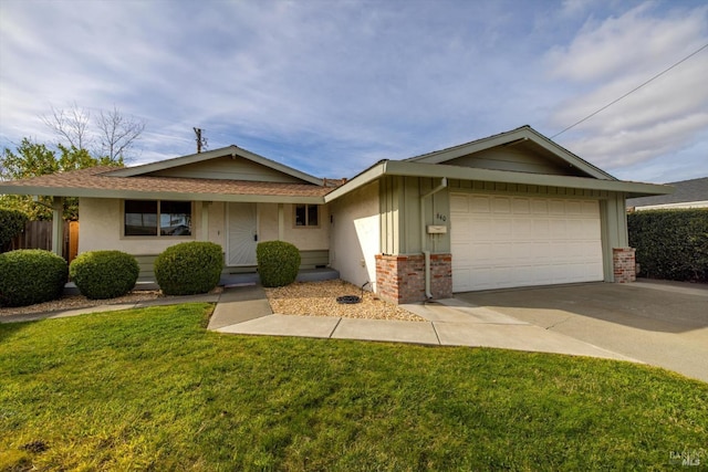 single story home with a front yard and a garage