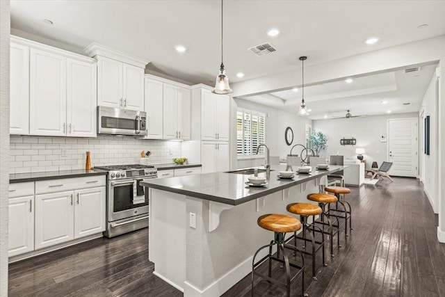 kitchen featuring white cabinetry, appliances with stainless steel finishes, and sink