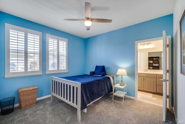 carpeted bedroom with connected bathroom and ceiling fan