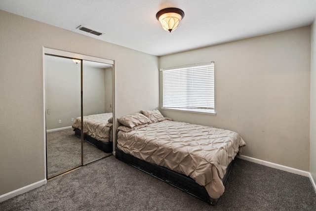 bedroom featuring carpet and a closet