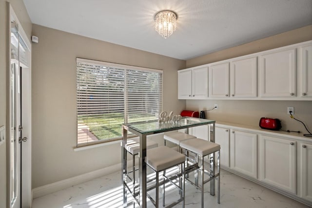 dining space featuring an inviting chandelier