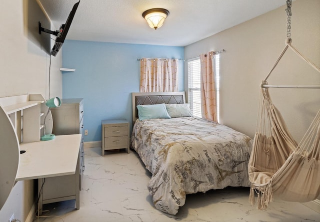 bedroom featuring a textured ceiling