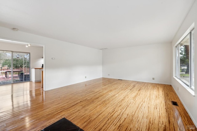 unfurnished room with light hardwood / wood-style floors