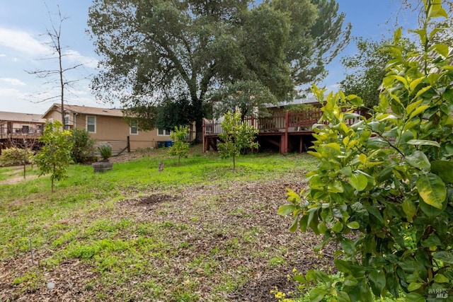 view of yard with a wooden deck