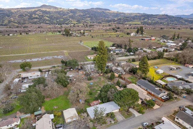 aerial view with a mountain view and a rural view