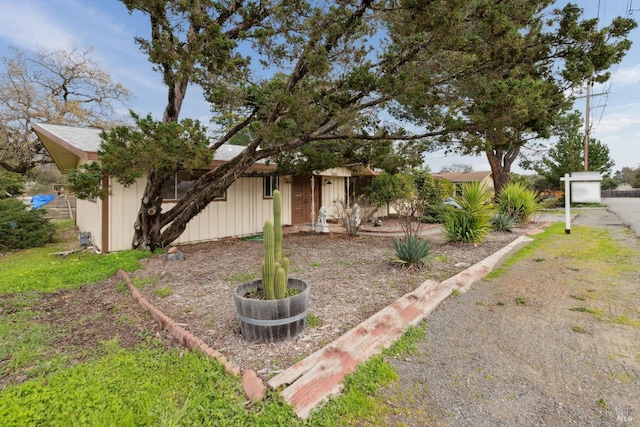 view of property hidden behind natural elements