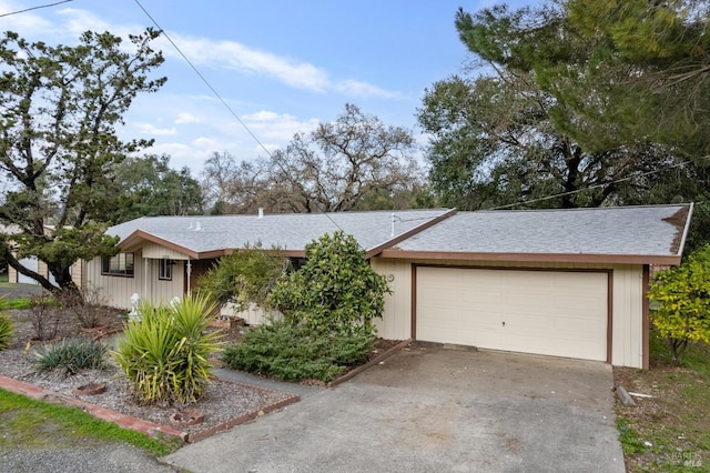 ranch-style house featuring a garage