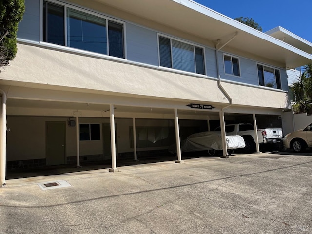 view of building exterior with a carport