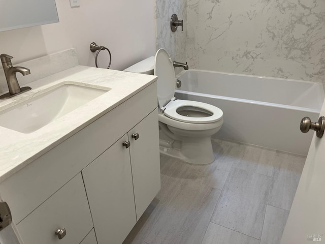 full bathroom featuring hardwood / wood-style flooring, shower / tub combination, vanity, and toilet