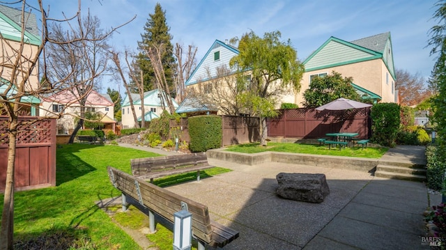 view of patio / terrace featuring fence