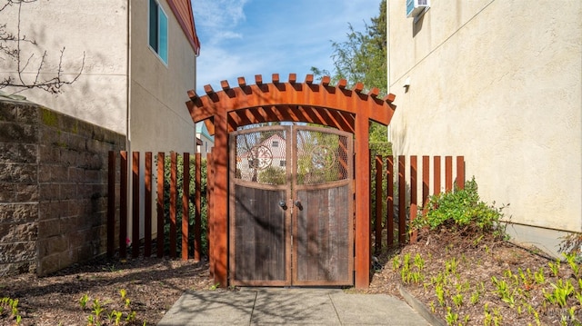 view of gate featuring fence