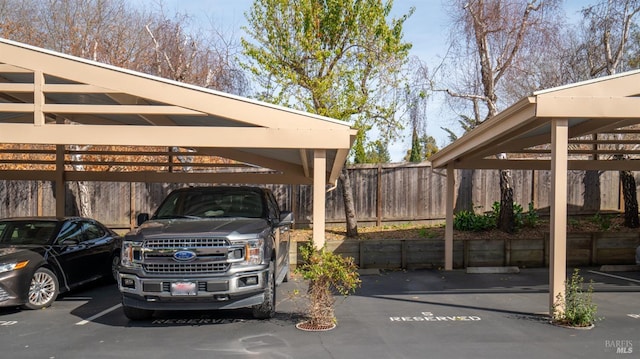 covered parking lot with fence