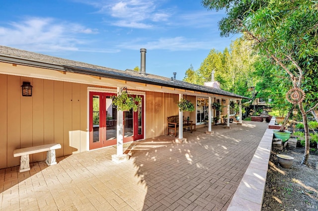 back of property featuring french doors and a patio