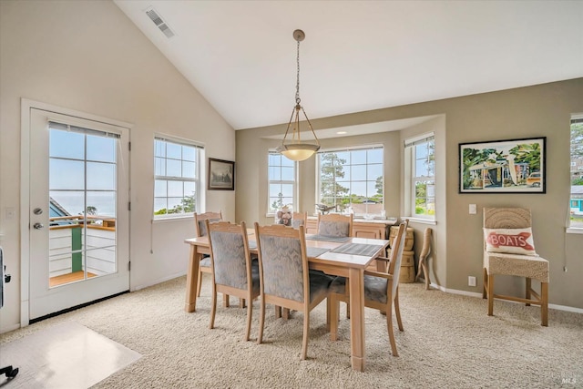 38934 Cypress Way, Gualala, CA 95445 - dining room featuring light carpet, high vaulted ceiling, and baseboards