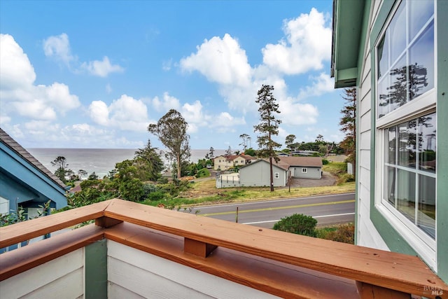 balcony featuring a water view