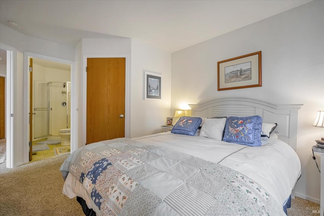 carpeted bedroom featuring ensuite bathroom