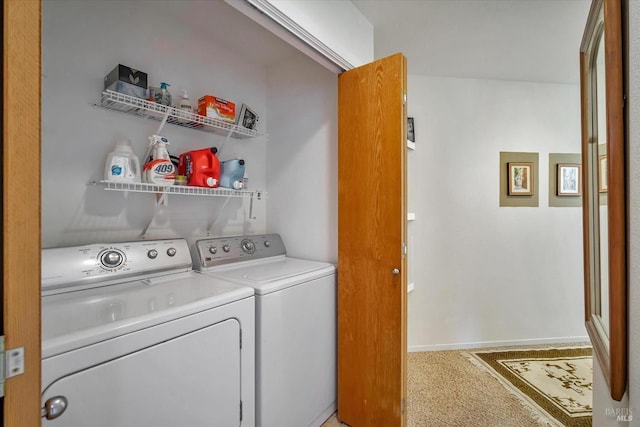 clothes washing area with independent washer and dryer and carpet