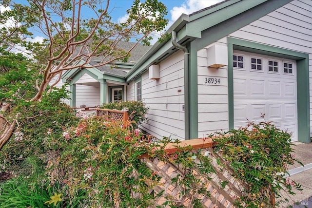 view of side of property with a garage