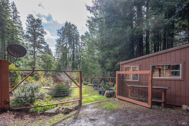 view of gate with fence