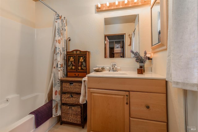 full bathroom with vanity and shower / tub combo with curtain