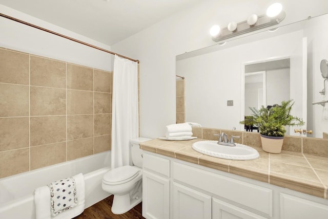 full bathroom with vanity, wood-type flooring, shower / bath combination with curtain, and toilet