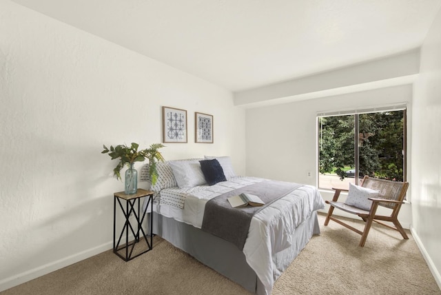 carpeted bedroom featuring access to outside