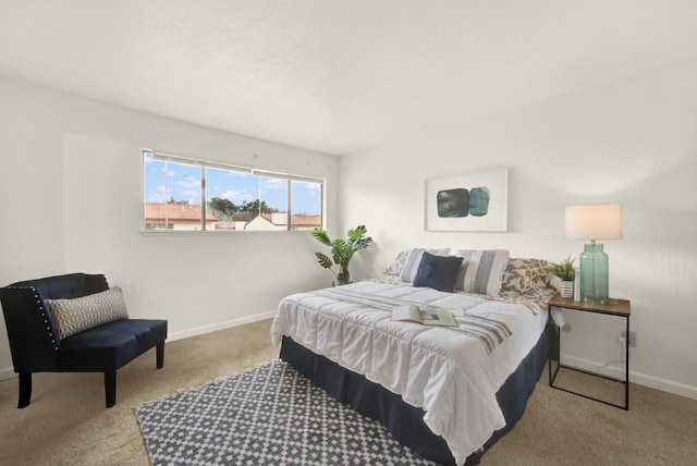 bedroom featuring light carpet