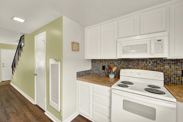 kitchen with white cabinetry, white appliances, tile countertops, and decorative backsplash