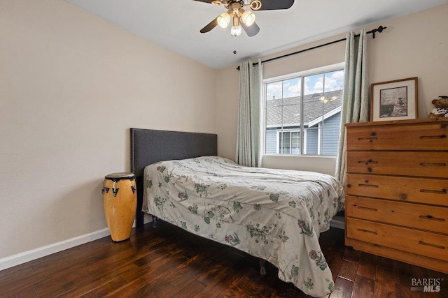 bedroom featuring dark wood-type flooring and ceiling fan