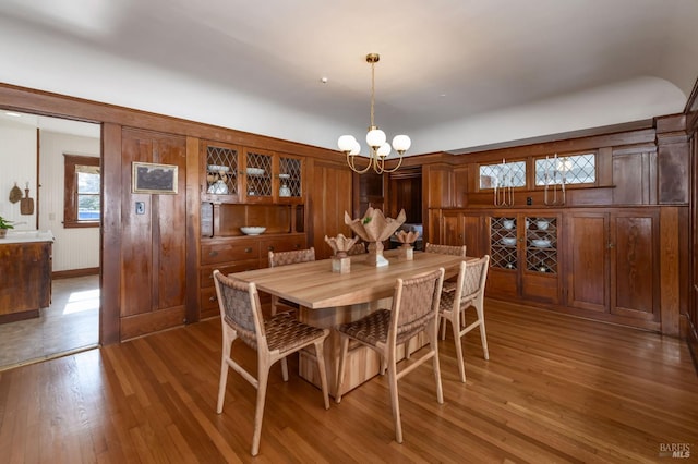 dining space featuring a chandelier and wood finished floors