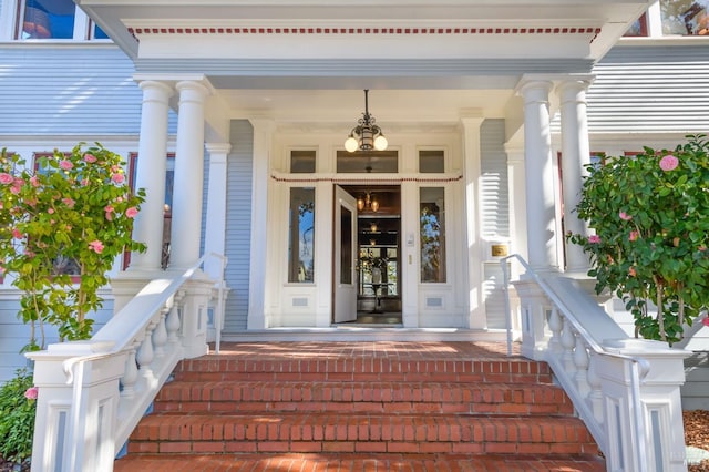view of exterior entry featuring a porch