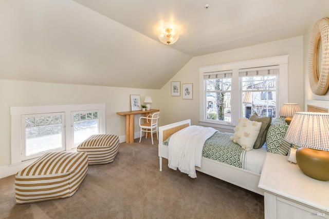 bedroom with multiple windows, carpet, and vaulted ceiling