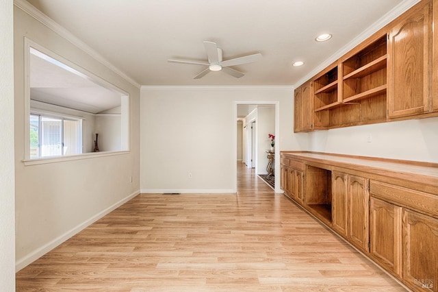 kitchen with open shelves, light wood-type flooring, baseboards, ceiling fan, and ornamental molding