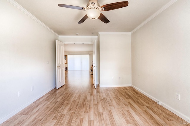 empty room with baseboards, crown molding, light wood-style flooring, and ceiling fan