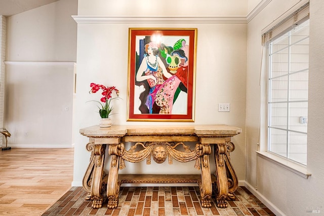 interior details featuring baseboards and wood finished floors