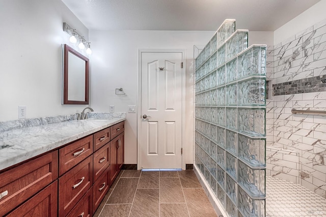bathroom featuring vanity and walk in shower