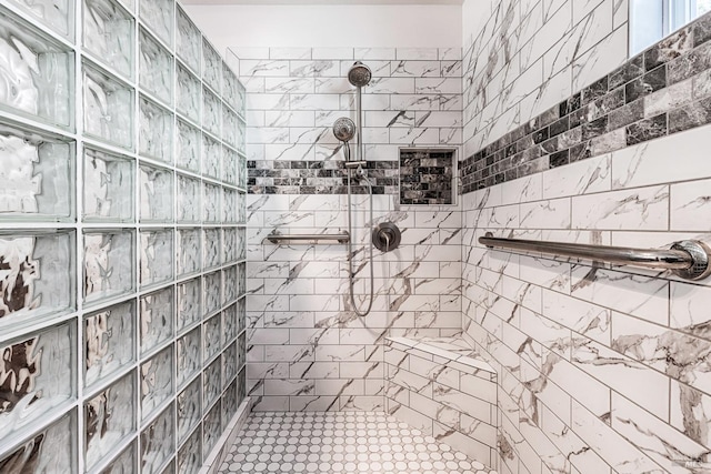 full bathroom with tiled shower