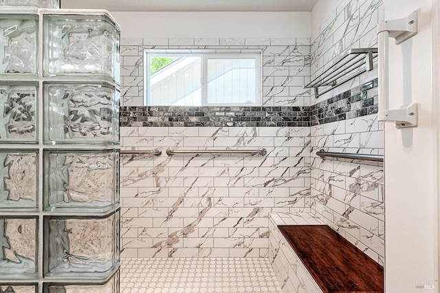full bathroom with tiled shower