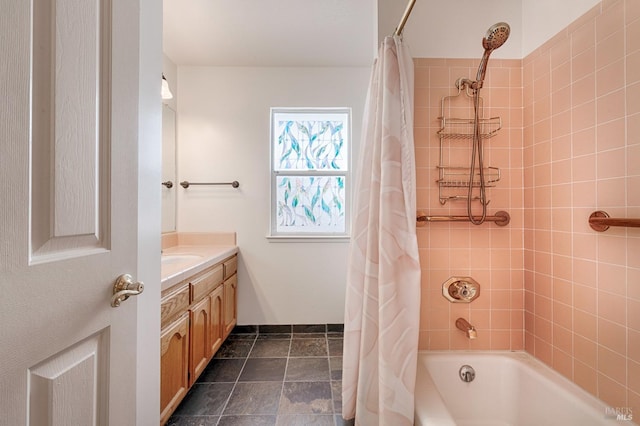 bathroom with shower / tub combo and vanity