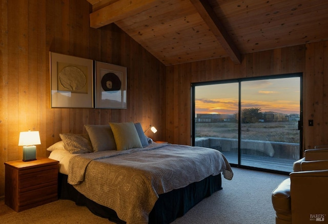 carpeted bedroom featuring wood walls, lofted ceiling with beams, and access to outside