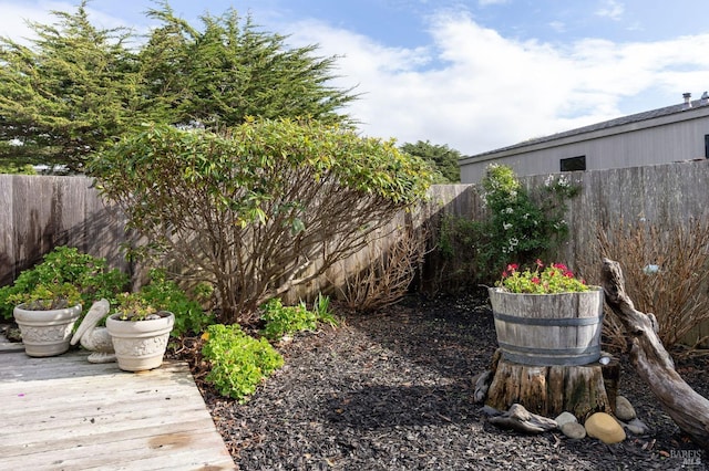 view of yard featuring a wooden deck