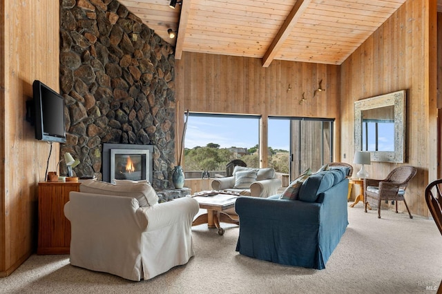 living room featuring a fireplace, wooden ceiling, beamed ceiling, and wood walls