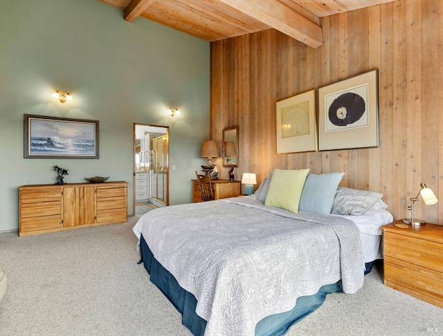 carpeted bedroom with beamed ceiling, high vaulted ceiling, wooden ceiling, and wooden walls