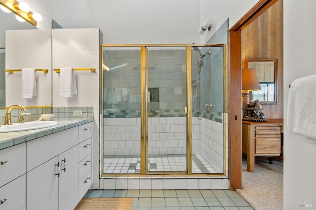 bathroom with vanity, tile patterned floors, and walk in shower