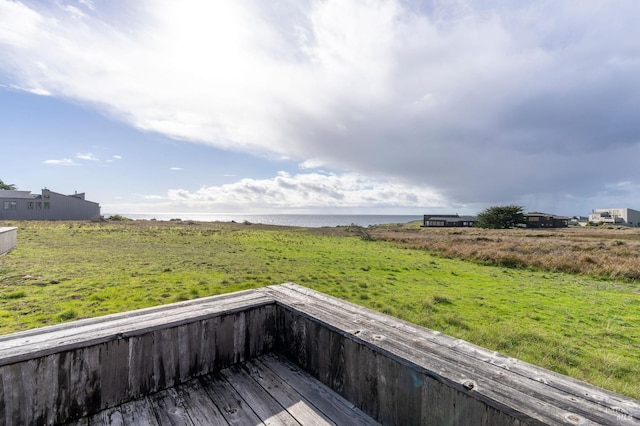 wooden deck featuring a water view