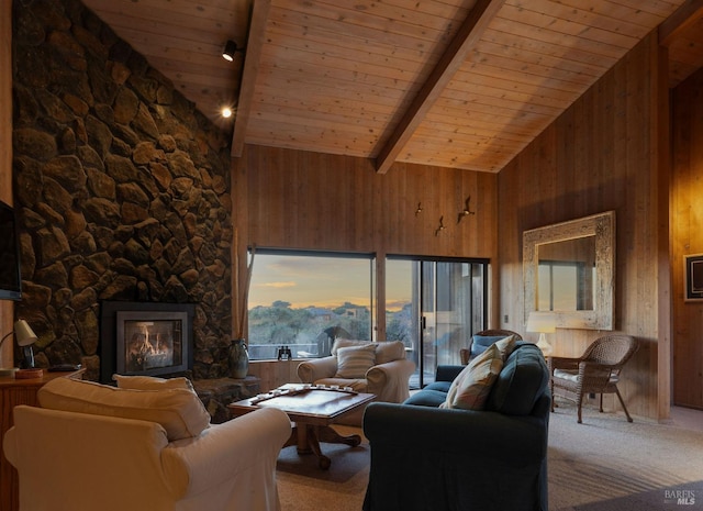 carpeted living room with wood ceiling, a stone fireplace, beamed ceiling, and wood walls