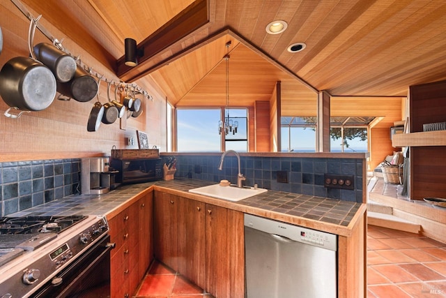 kitchen with sink, tile countertops, stainless steel dishwasher, and range with gas cooktop